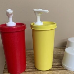 Red and Yellow Tupperware Pump Dispenser Set.